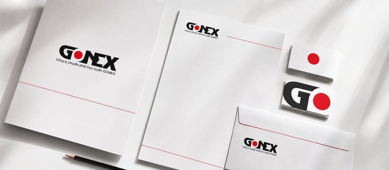 Bộ nhận diện Gonext: name card, đầu thư và phong bì mang dấu chấm đỏ