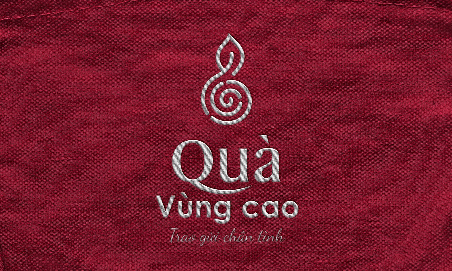Dấu Quà vùng cao ép nhũ trên nền vải đỏ trầm